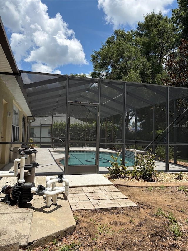 19480 SW 100th Loop, Dunnellon, FL 34432 - outdoor pool with a patio and glass enclosure