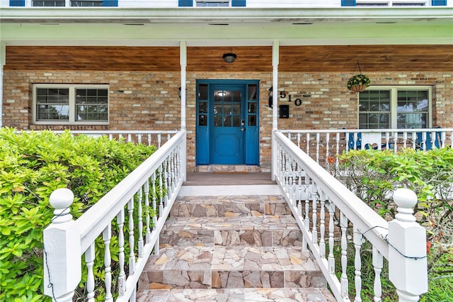 510 SE 19th St, Ocala, FL 34471 - doorway to property featuring covered porch and brick siding