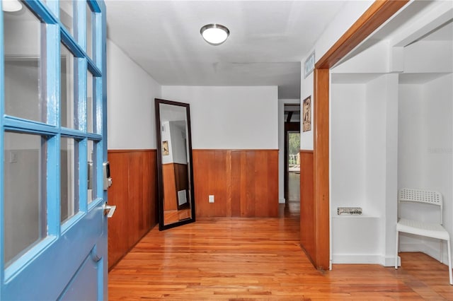 510 SE 19th St, Ocala, FL 34471 - corridor featuring light wood-type flooring, a wainscoted wall, and wood walls