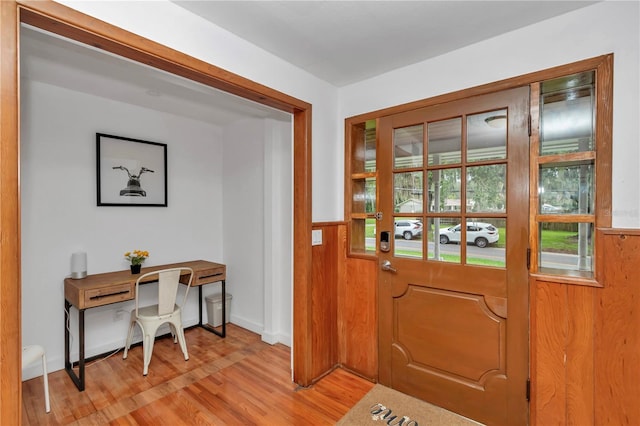 510 SE 19th St, Ocala, FL 34471 - doorway to outside featuring light wood-style floors and wainscoting