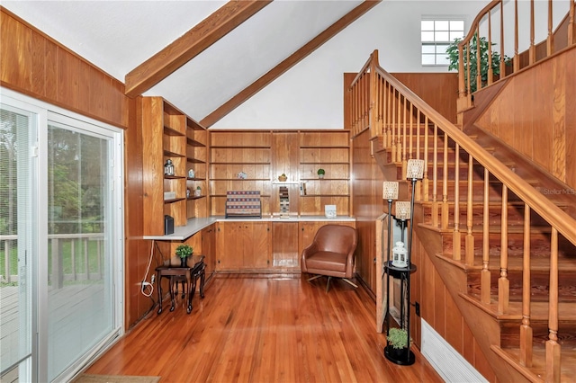 510 SE 19th St, Ocala, FL 34471 - stairs with beam ceiling, wood finished floors, high vaulted ceiling, and wooden walls