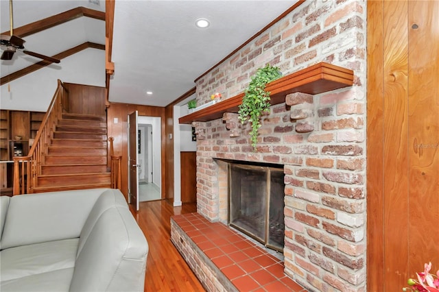 510 SE 19th St, Ocala, FL 34471 - living area featuring ceiling fan, a brick fireplace, wood finished floors, stairway, and recessed lighting