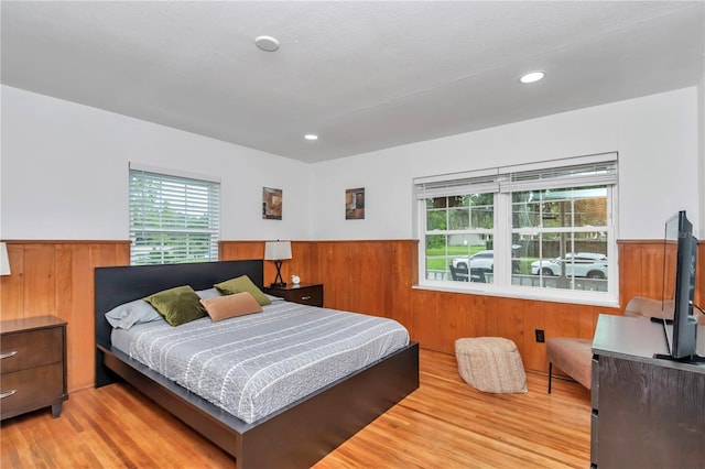 510 SE 19th St, Ocala, FL 34471 - bedroom featuring wood finished floors, a wainscoted wall, wood walls, and recessed lighting