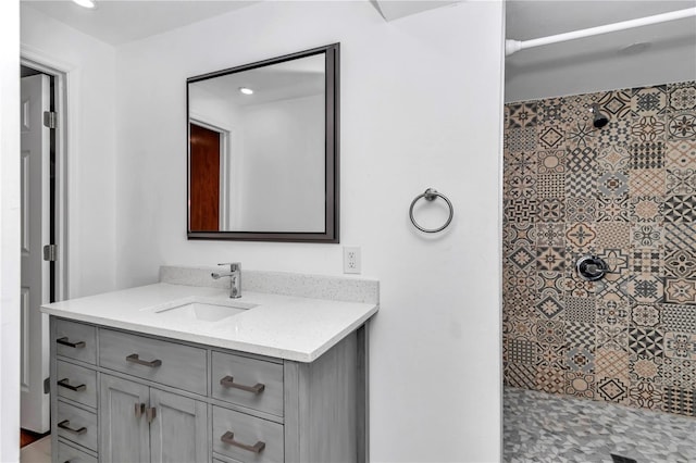 510 SE 19th St, Ocala, FL 34471 - bathroom featuring vanity, tiled shower, and recessed lighting
