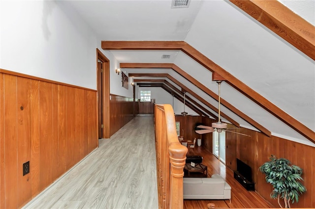 510 SE 19th St, Ocala, FL 34471 - stairs featuring wooden walls, wood finished floors, wainscoting, and a ceiling fan
