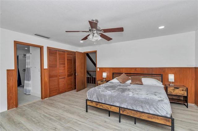 510 SE 19th St, Ocala, FL 34471 - bedroom with wood finished floors, a closet, recessed lighting, wainscoting, and ceiling fan