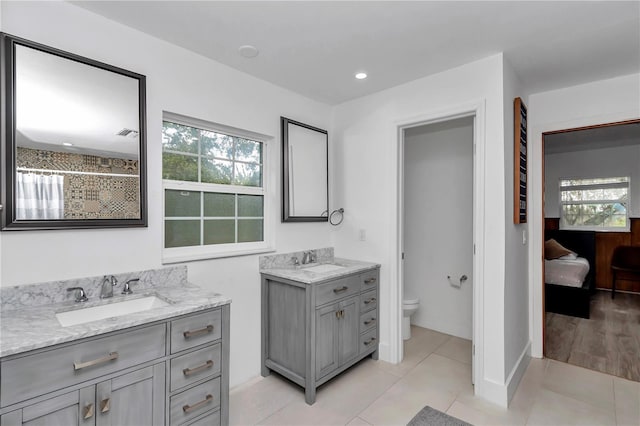 510 SE 19th St, Ocala, FL 34471 - bathroom with two vanities, plenty of natural light, tile patterned floors, recessed lighting, and a shower with shower curtain
