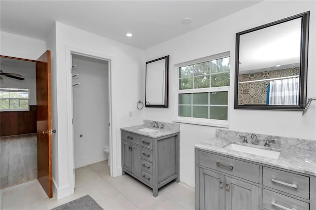 510 SE 19th St, Ocala, FL 34471 - full bath with two vanities, a shower with shower curtain, and a ceiling fan