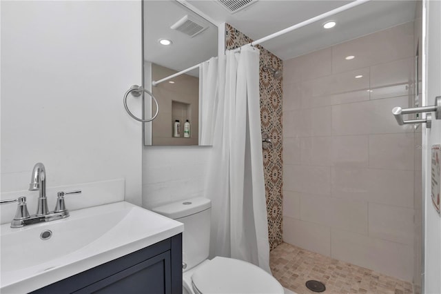 510 SE 19th St, Ocala, FL 34471 - bathroom featuring tiled shower, vanity, and recessed lighting