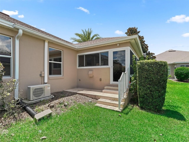 2721 Day Lily Run, The Villages, FL 32162 - back of property with stucco siding, entry steps, and a lawn