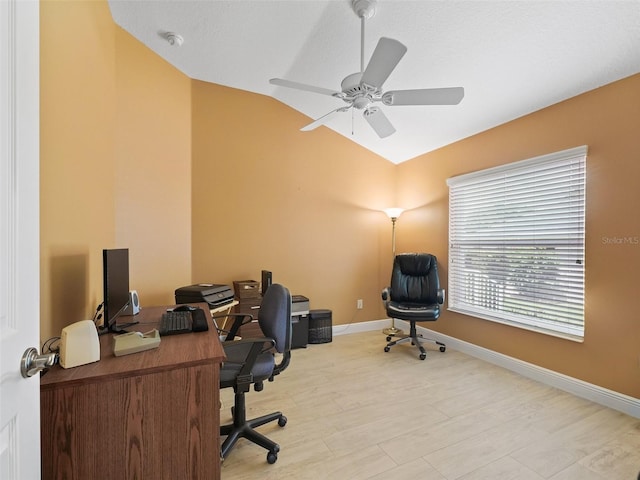 2721 Day Lily Run, The Villages, FL 32162 - office area featuring vaulted ceiling, a ceiling fan, and wood finished floors
