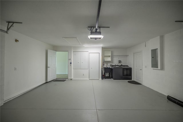 458 Marion Oaks Trl, Ocala, FL 34473 - garage featuring washing machine and dryer, electric panel, and a garage door opener