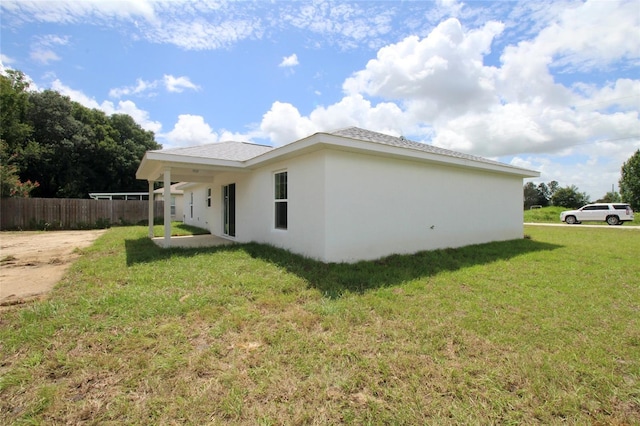 9 Hemlock Terrace Ln, Ocala, FL 34472 - view of side of home featuring stucco siding