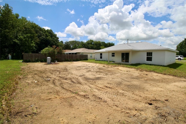 9 Hemlock Terrace Ln, Ocala, FL 34472 - rear view of house featuring stucco siding
