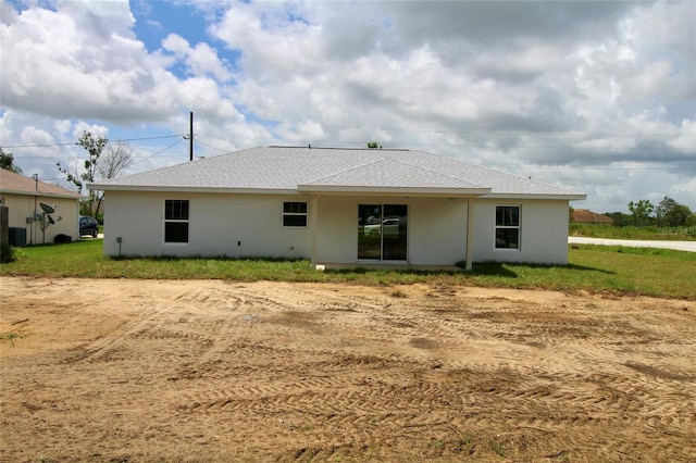 9 Hemlock Terrace Ln, Ocala, FL 34472 - rear view of property with stucco siding