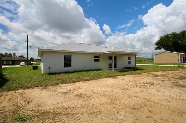 9 Hemlock Terrace Ln, Ocala, FL 34472 - rear view of property with stucco siding