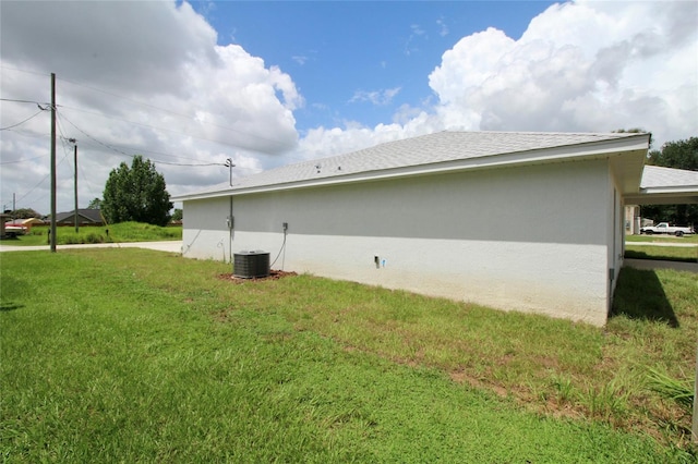 9 Hemlock Terrace Ln, Ocala, FL 34472 - view of side of property with a yard and stucco siding