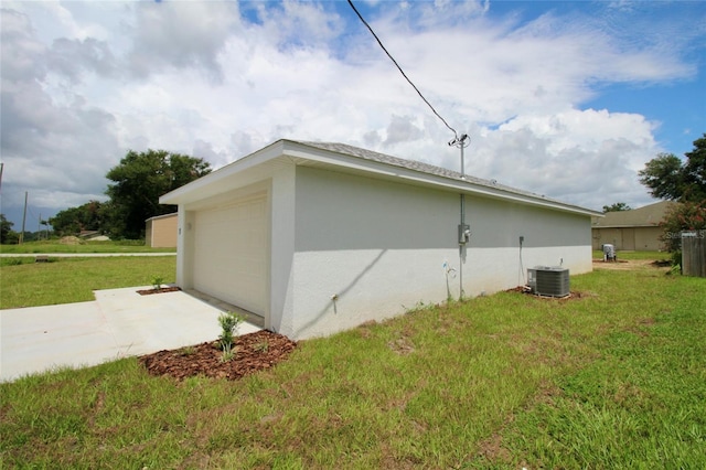 9 Hemlock Terrace Ln, Ocala, FL 34472 - view of home's exterior featuring driveway, a yard, a garage, and stucco siding
