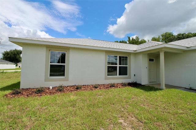 9 Hemlock Terrace Ln, Ocala, FL 34472 - view of side of home featuring a yard and stucco siding