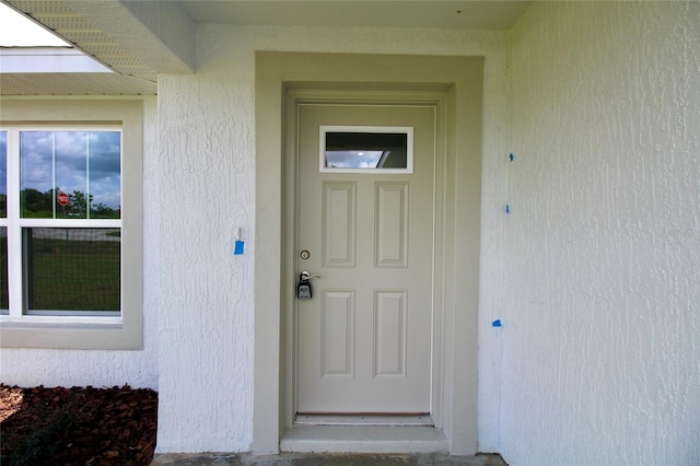9 Hemlock Terrace Ln, Ocala, FL 34472 - property entrance featuring stucco siding