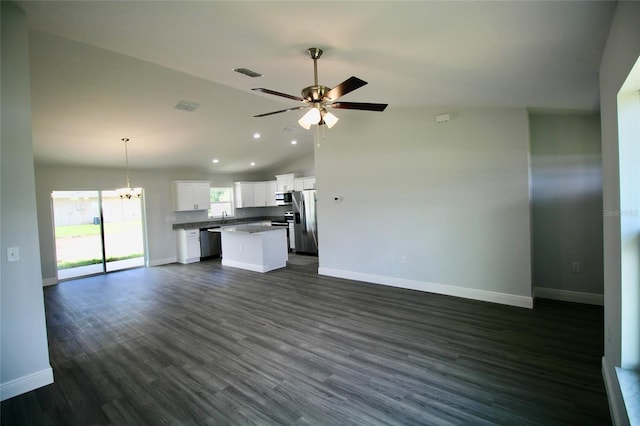 9 Hemlock Terrace Ln, Ocala, FL 34472 - unfurnished living room featuring vaulted ceiling, recessed lighting, a ceiling fan, a chandelier, and dark wood-style flooring