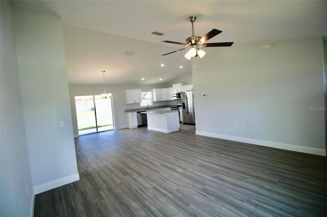 9 Hemlock Terrace Ln, Ocala, FL 34472 - unfurnished living room with a chandelier, a ceiling fan, vaulted ceiling, dark wood-style flooring, and recessed lighting
