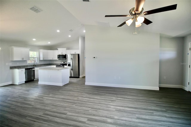 9 Hemlock Terrace Ln, Ocala, FL 34472 - kitchen featuring appliances with stainless steel finishes, open floor plan, a kitchen island, white cabinets, and lofted ceiling