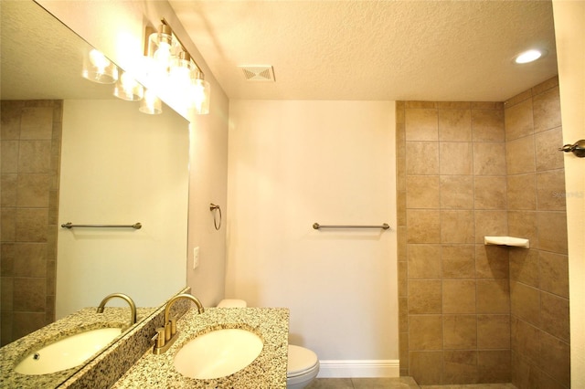 9 Hemlock Terrace Ln, Ocala, FL 34472 - full bathroom featuring a textured ceiling, a walk in shower, vanity, and tile patterned flooring