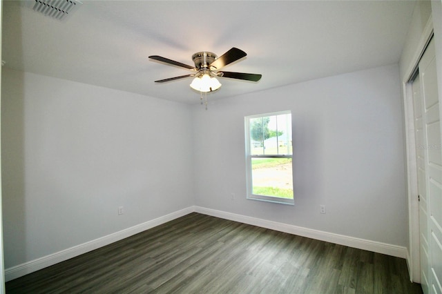 9 Hemlock Terrace Ln, Ocala, FL 34472 - unfurnished room with dark wood finished floors and a ceiling fan