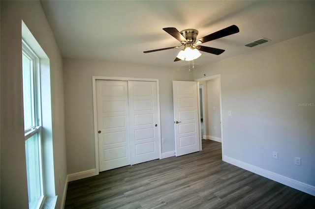 9 Hemlock Terrace Ln, Ocala, FL 34472 - unfurnished bedroom featuring a closet, wood finished floors, and ceiling fan