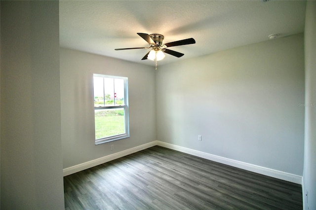 9 Hemlock Terrace Ln, Ocala, FL 34472 - empty room featuring dark wood finished floors, a ceiling fan, and a smoke detector