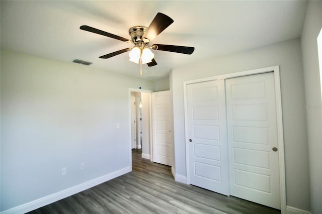 9 Hemlock Terrace Ln, Ocala, FL 34472 - unfurnished bedroom with wood finished floors, a closet, and ceiling fan
