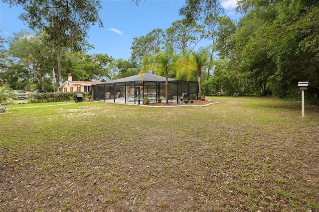 581 NE 44th Ave, Ocala, FL 34470 - view of green lawn with a lanai
