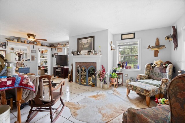 581 NE 44th Ave, Ocala, FL 34470 - living area with light tile patterned flooring, a fireplace, and ceiling fan