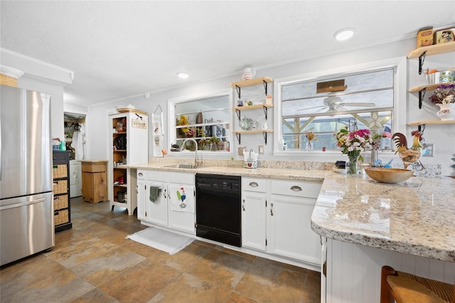 581 NE 44th Ave, Ocala, FL 34470 - kitchen with freestanding refrigerator, dishwasher, open shelves, white cabinets, and light stone finish floors