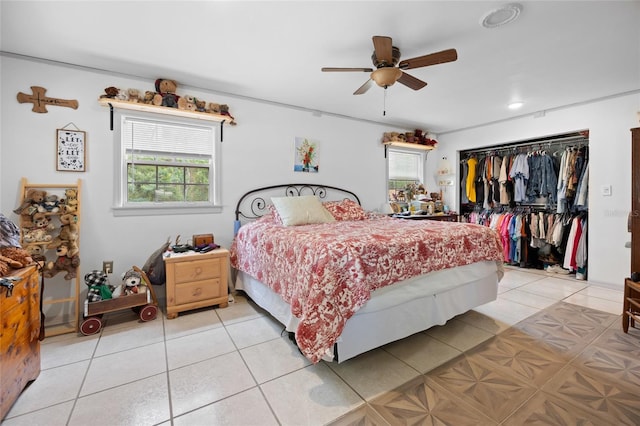 581 NE 44th Ave, Ocala, FL 34470 - bedroom featuring multiple windows, a closet, light tile patterned flooring, and a ceiling fan