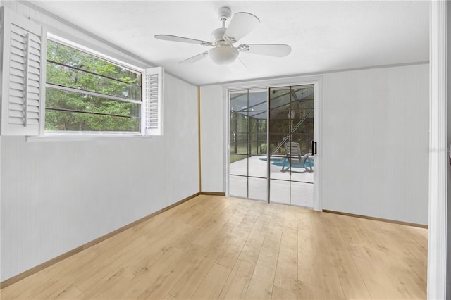 581 NE 44th Ave, Ocala, FL 34470 - empty room featuring wood-type flooring and a ceiling fan