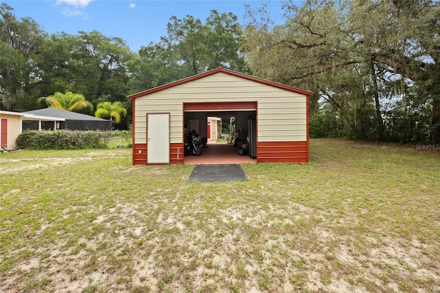 581 NE 44th Ave, Ocala, FL 34470 - detached garage featuring view of wooded area