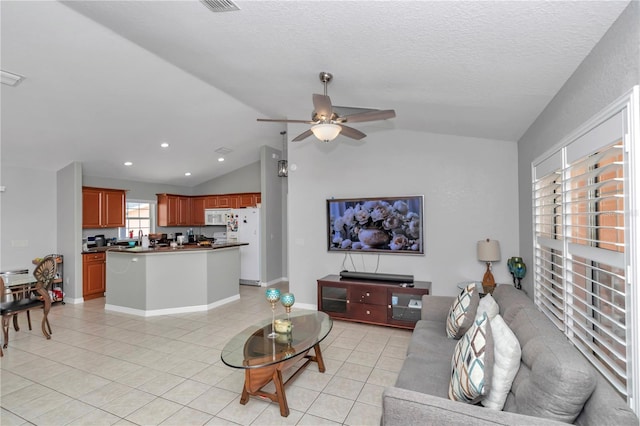 3453 SE 147th Ln, Summerfield, FL 34491 - living area featuring vaulted ceiling, light tile patterned floors, a ceiling fan, and recessed lighting
