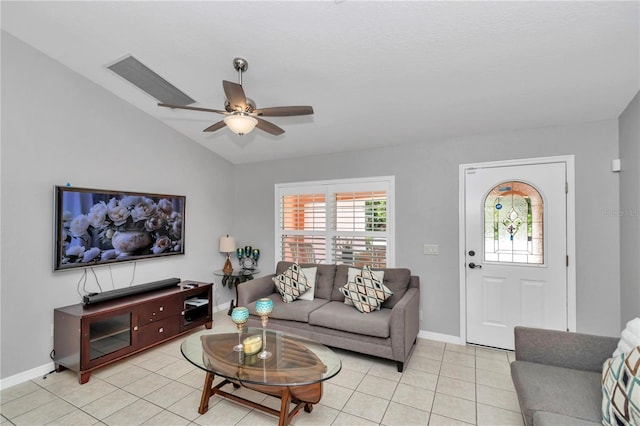 3453 SE 147th Ln, Summerfield, FL 34491 - living room with vaulted ceiling, light tile patterned floors, and a ceiling fan