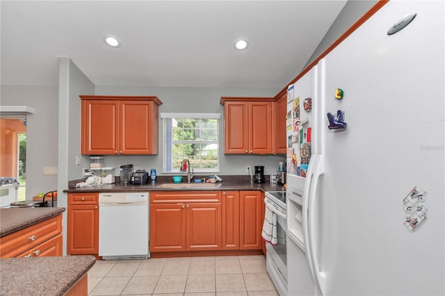 3453 SE 147th Ln, Summerfield, FL 34491 - kitchen with white appliances, dark countertops, recessed lighting, and light tile patterned flooring