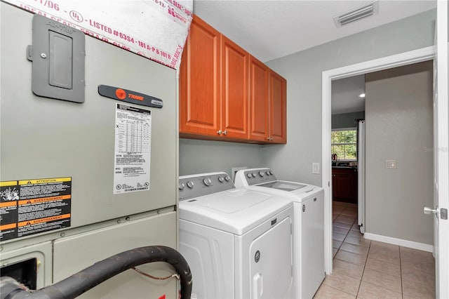3453 SE 147th Ln, Summerfield, FL 34491 - laundry room with cabinet space, light tile patterned flooring, independent washer and dryer, and heating unit