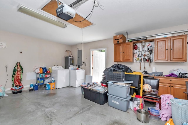 3453 SE 147th Ln, Summerfield, FL 34491 - garage featuring a garage door opener, washer and clothes dryer, electric panel, and electric water heater