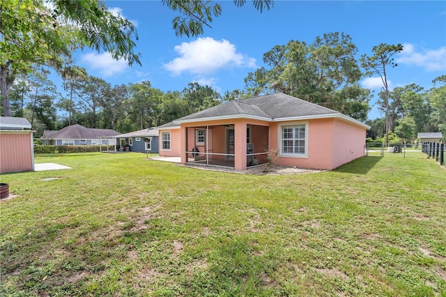 3453 SE 147th Ln, Summerfield, FL 34491 - back of house with a sunroom and stucco siding