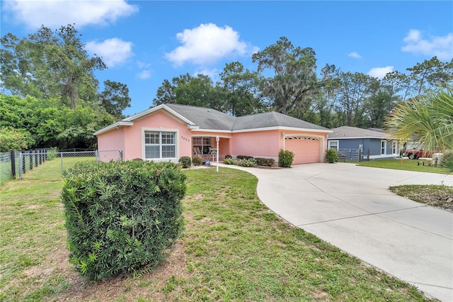 3453 SE 147th Ln, Summerfield, FL 34491 - ranch-style house featuring a garage, concrete driveway, and stucco siding