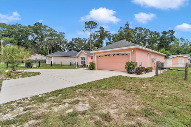 3453 SE 147th Ln, Summerfield, FL 34491 - single story home with driveway, stucco siding, and a garage