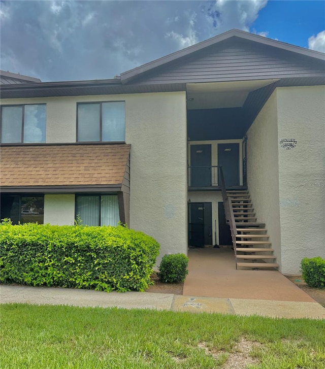 550 Fairways Dr Unit A, Ocala, FL 34472 - view of building exterior featuring stairs