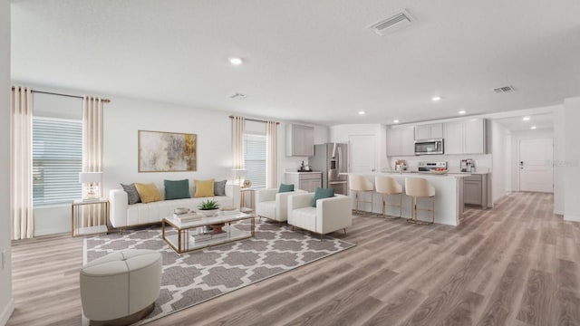 13261 SW 56th Ter, Ocala, FL 34473 - living room with light wood-style floors and recessed lighting