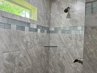 1467 E Odin Dr, Citrus Springs, FL 34434 - full bathroom with tiled shower