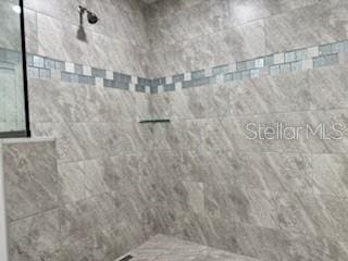 1467 E Odin Dr, Citrus Springs, FL 34434 - full bathroom with a tile shower